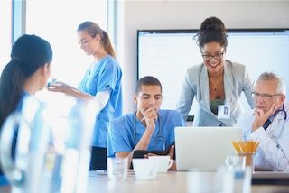 BPO consulting team working in hospital office